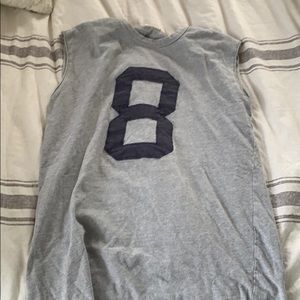 A used number eight Tank top.